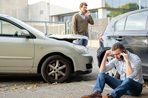 Two Men Calling Car Help Assistance After An Accident