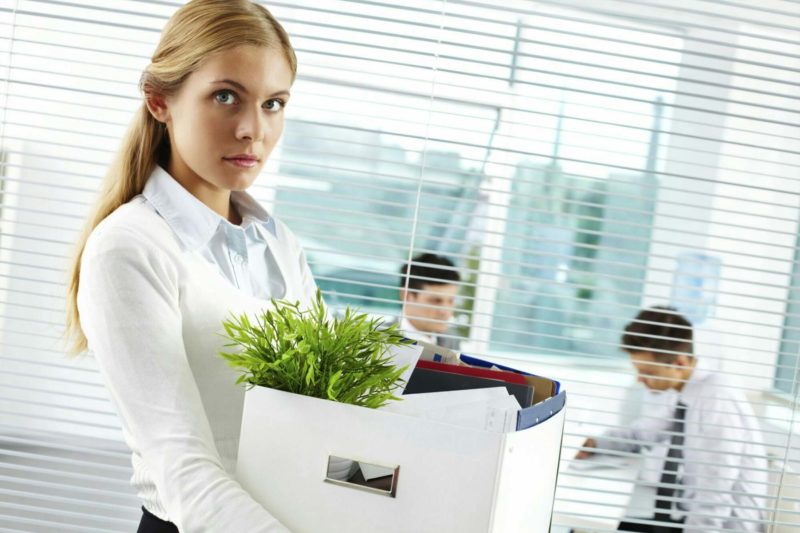 Woman Packing Her stuff To Leave The Office