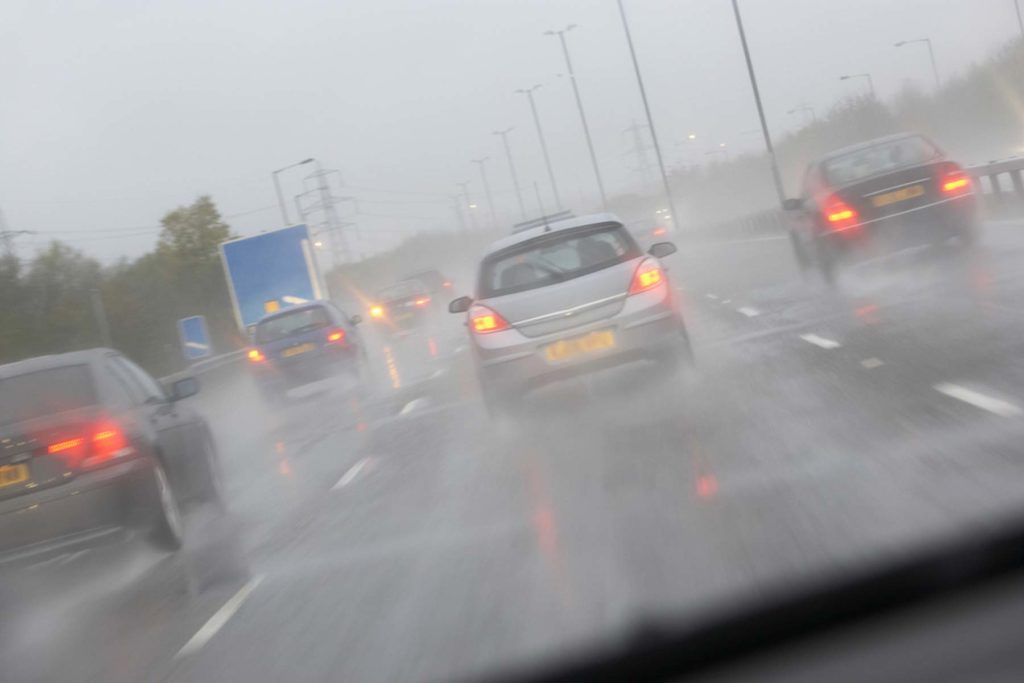 Cars Driving In Wet Weather