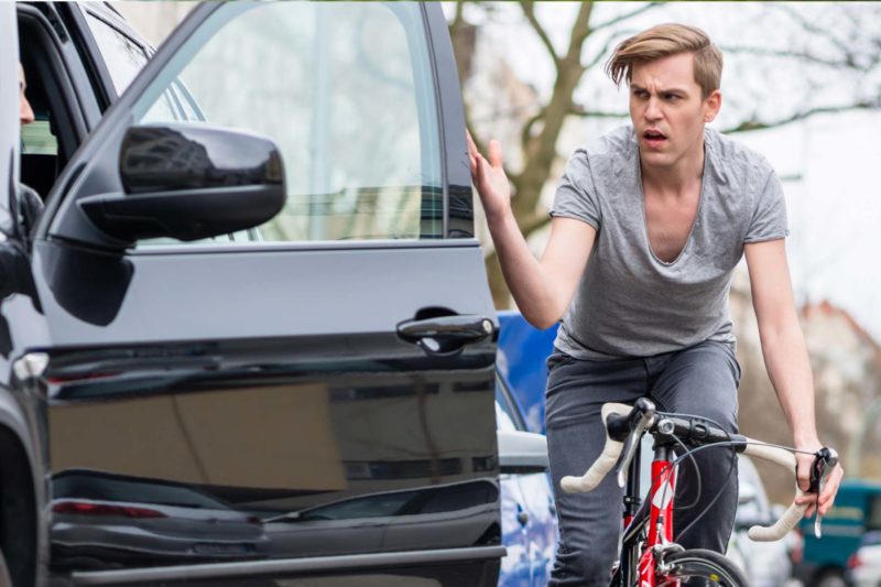 Angry Bicycle Rider Yelling At Rude Car Driver