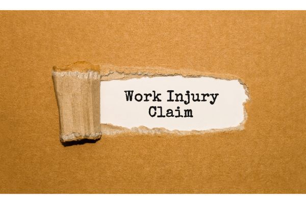 "Work Injury Claim" written On Torn Paper