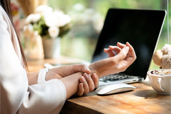 Woman Holding Injured Wrist